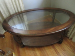 lot 170 image: OVAL WOOD AND GLASS COFFEE TABLE