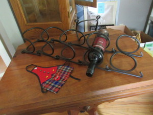 lot 526 image: INTERLOCKING METAL WINE RACK AND A BOTTLE APRON