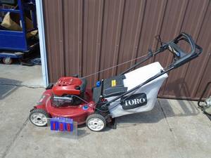Toro personal pace mower with bagger. Used condition. Tested & works. As shown.