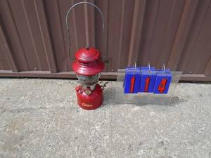 Vintage red Coleman lantern. Has a few chipe in paint otherwise in nice shape. As shown.