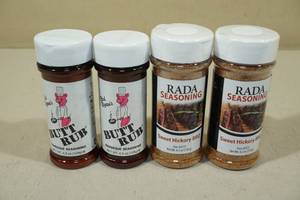 lot 106 image: 4 Bottles of Seasoning -2 Bad Byrons BBQ, 2 Rada Sweet Hickory BBQ