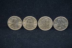 lot 134 image: 4 US Presidential Dollar Coins - Garfield, Grant, Hayes, Johnson
