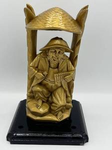 lot 117 image: Vintage Gold-Toned Wood Carving of Man with Xylophone