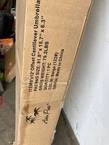 lot 59 image: Abba Patio 9 x 12 ft. Cream Outdoor Patio Umbrella with Tilt and Crank Lift