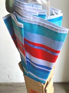lot 186 image: Sunnydaze Decor 6 ft. UV Protection Stainless Steel Market Tilt Beach Umbrella in Pacific Stripe
