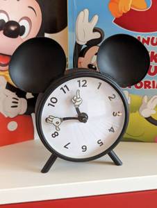 lot 70 image: Pottery Barn Mickey Mouse Clock and Books