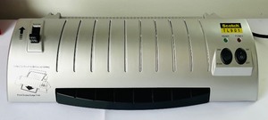 lot 261 image: Scotch Laminating Machine with Open Package of Laminating Pouches