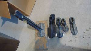 Vintage shoe cobbler set with different sized shoehorns