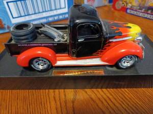 lot 44 image: 1939 Chev Pickup 124th Scale on Plastic Stand - No Box, and an NFL 180th Scale Die Cast Metal Vikings Tractor Trailer