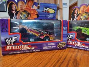 lot 45 image: Four WWF Attitude Racing Cars made by Road Champs in Original Boxes - Die Cast Metal