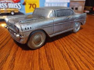 lot 46 image: 1957 Chevrolet Metal Bank (Bottom Broken Into) and The Munsters Drag-u-la on Stand, approx. 143rd Scale, No Boxes
