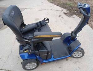 lot 50 image: Pride Victory 4-Wheel Mobility Cart with Pride Vinyl Cover, Missing Charger, will Need New Batteries Also