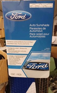 lot 58 image: Ozark Trailer Cooler and a New Ford Windshield Shade (Never Opened)