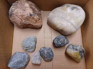 lot 64 image: Eight Unique Rocks and Stones and and a Rocks and Minerals Display Card