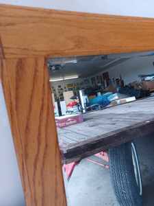 lot 67 image: Large Tru-flect Beveled Mirror in an Oak Frame in Very Good Condition, Measures 34-inches X 52-inches