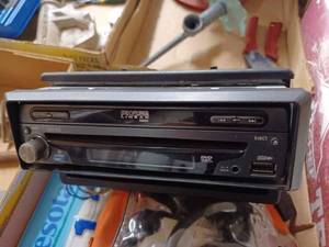 lot 83 image: Two Boxes of Automotive Items Pair of Jumper Cables in Original Bag, Minnesota License Plates, Phase Linear CD Player