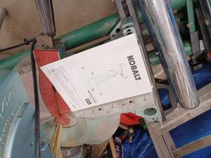 lot 98 image: Hitachi Power Miter Saw with a Kobalt Roller Stand - Works