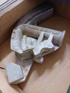 lot 112 image: Box of Tools Containing a 34-inch Conduit Bender, Battery Operated Stud Finder, Cable Cutter, and Two Wire Strippers