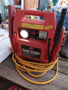 lot 117 image: ATD Booster Pack 12-Volt, 1700 Peak Amp Jump Starter with Built-In Light and Power Cord - Not Original Cord for this