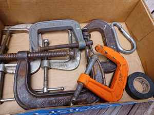 lot 123 image: Six Assorted C Clamps, Electrical Tape, and a Box of Peg Board Hooks