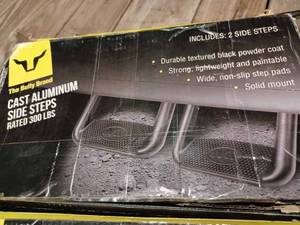 lot 127 image: New in Original Box of Two Steps - The Bully Brand Cast Aluminum Side Steps for Most Makes and Models of Pickups