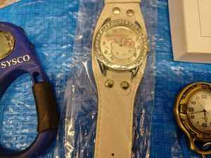 lot 146 image: Hello Kitty Wrist Watch, Quartz Pendant Watch, Sysco Souvenir Compas and Watch, DVD Laser Lens Cleaner Disc