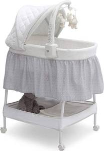 lot 298 image: New  Delta Children Deluxe Gliding Bassinet