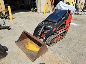 lot 4 image: Toro Dingo Utility Loader with Bucket Attachment
