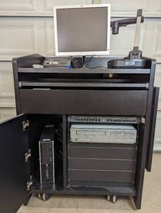 lot 6 image: Presentation Podium on Wheels With Equipment - Magnavox DV225MG9 DVD Player and 4 Head Hi-Fi Stereo VCR, Samsung SDP-860 SXGA Digital Presenter, Exetron Tuner & Switch, HP PC