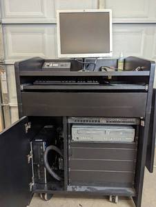 lot 13 image: Presentation Podium on Wheels With Equipment - Magnavox DV225MG9 DVD Player and 4 Head Hi-Fi Stereo VCR, Exetron Tuner & Switch, HP PC