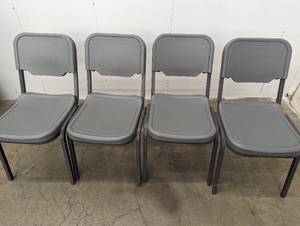 lot 29 image: 4 Stackable Chairs - See Pictures