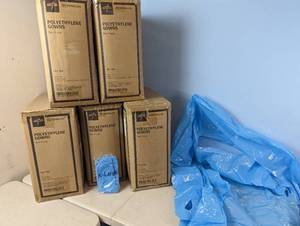 lot 146 image: 5 Cases Medline Polyethelyne Gowns, 100 Per Case (500 Gowns Total)