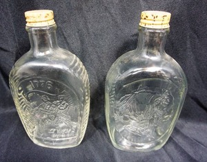 lot 6 image: (2) Vintage Log Cabin Syrup Glass Container, Embossed Bicentennial Fife Solider BandIndian Chief, Metal Faux Wood Grain Screw On Top, Retro Patriotic Bottle
