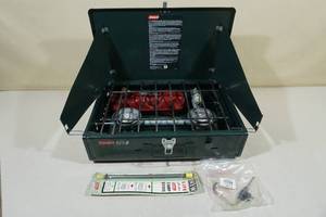 lot 99 image: Coleman Duel Fuel Camping Stove with Parts