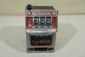 lot 180 image: Vintage Nevada Buckaroo Bank Slot Machine