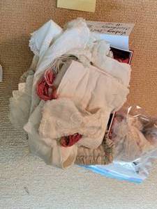 Doll clothes and damaged doll