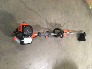 lot 17 image: ECHO  25.4 cc Gas 2-Stroke Straight Shaft String Trimmer Customer Returns See Pictures