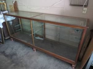lot 125 image: Large Antique Store Display Cabinet with Adjustable Shelves, Beveled Glass and Sliding Glass Door