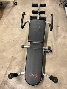 lot 27 image: MSRP $350 Sunny Health & Fitness SF-BH6719 Invert Extend-N-Go Back Stretcher Decompression Exercise Bench - Great Working Condition - Has Tear In Seat See Youtube For How This Pain Reliever Back Inverter Stretcher Works  Sold Out In Many Areas
