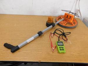 lot 44 image: Measuring Wheel , Becon Light , Battery Tester