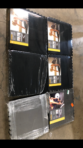 lot 11 image: Lot of Mixed Black Carpet Texture Top 24 in. x 24 in. x 12 mm Interlocking Tiles for Home Gym Kids Room and Living Room (96 sq. ft.)   Customer Returns See Pictures