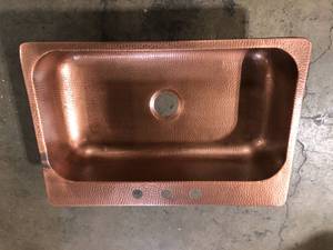 lot 21 image: SINKOLOGY  Angelico Drop-In Handmade Pure Copper 33 in. 3-Hole Single Bowl Kitchen Sink in Hammered Antique Copper Customer Returns See Pictures