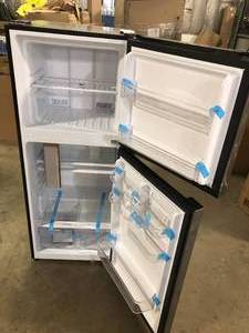 lot 27 image: Magic Chef  10.1 cu. ft. Top Freezer Refrigerator in Platinum Steel  Customer Returns See Pictures