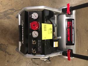 lot 42 image: Husky  4.5 Gal. Portable Electric-Powered Silent Air Compressor  Customer Returns See Pictures