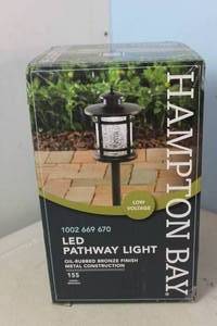 lot 12 image: NEW - Hampton Bay Birmingham 3-Watt Oil Rubbed Bronze Outdoor Integrated LED Landscape Path Light with Crackled Shade 6940500318165 MSRP $44.97
