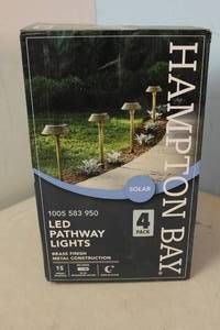 lot 14 image: RETURN - Hampton Bay 15 Lumens Solar Warm Brass LED Landscape Pathway Lights (4-Pack) 842674050178 MSRP $59.99