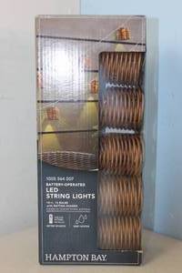 lot 76 image: NEW - Hampton Bay IndoorOutdoor 15.4 ft. 10-Light Brown Battery Powered Bell-Shaped Integrated LED Bulb Rattan String Lights 012109105791 MSRP $19.97