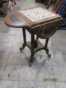 lot 39 image: Antique table with drop down leaves.