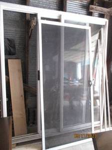 lot 410 image: Vinyl double pane patio door with s...