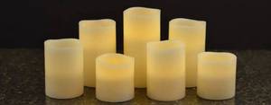 lot 97 image: Members Mark 7-Piece Flameless Candle Pillar Set with Remote and Timer